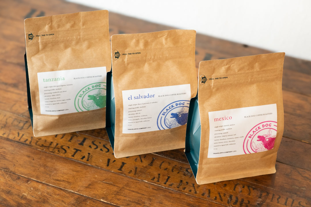 Front of Black Dog Coffee Roasters collaborative coffee beans in three different bags.