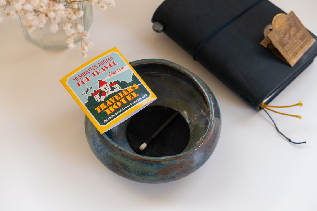 Hibi incense matches in TRC custom packaging on top of ceramic bowl.