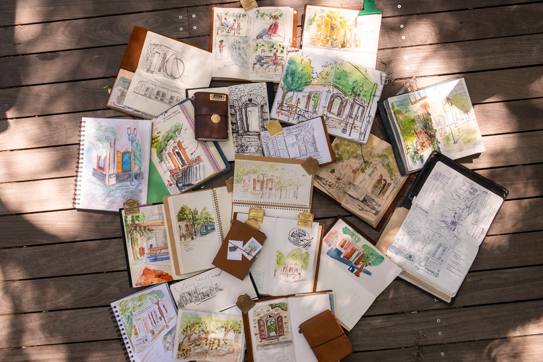 A "throw-down" of TRAVELER'S notebook and sketchbooks from a sketch crawl.