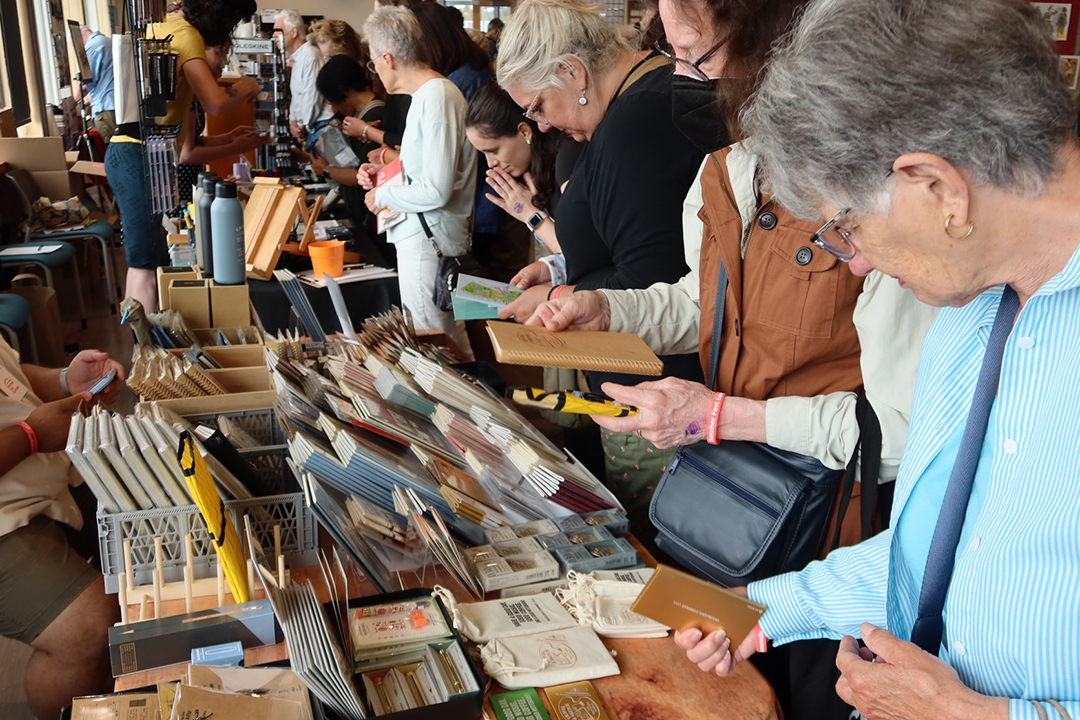 Artists and fans poured over the TRC USA table at Sketcher Fest Edmonds.