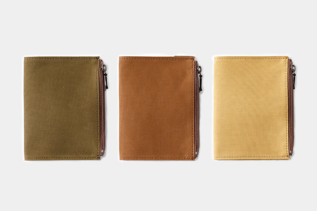 TF Cotton Zipper Cases in Passport Size in olive, brown, and beige.