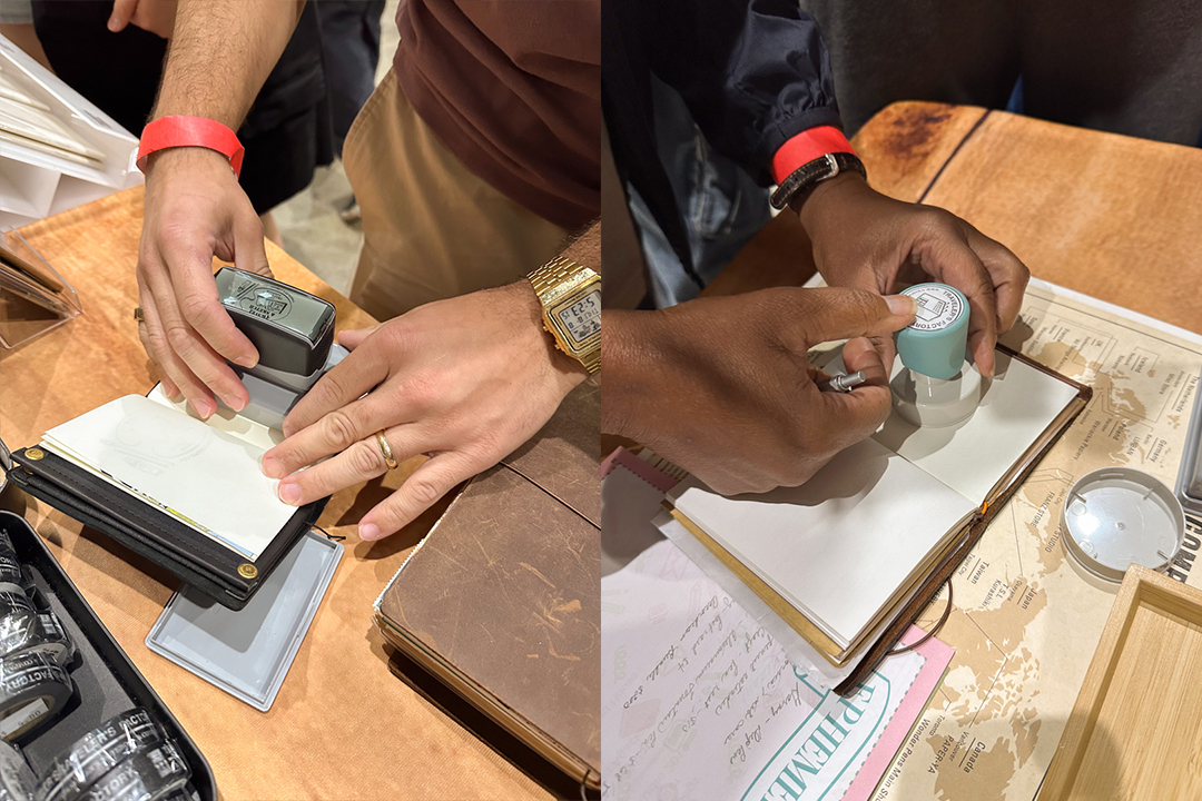 TRAVELER'S notebook users stamping their TRAVELER'S notebooks.