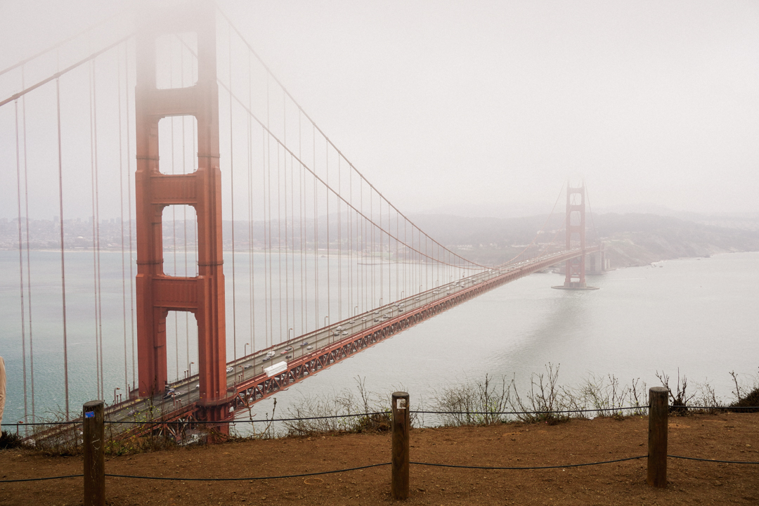 The Golden Gate Bridge shrouded in fog.