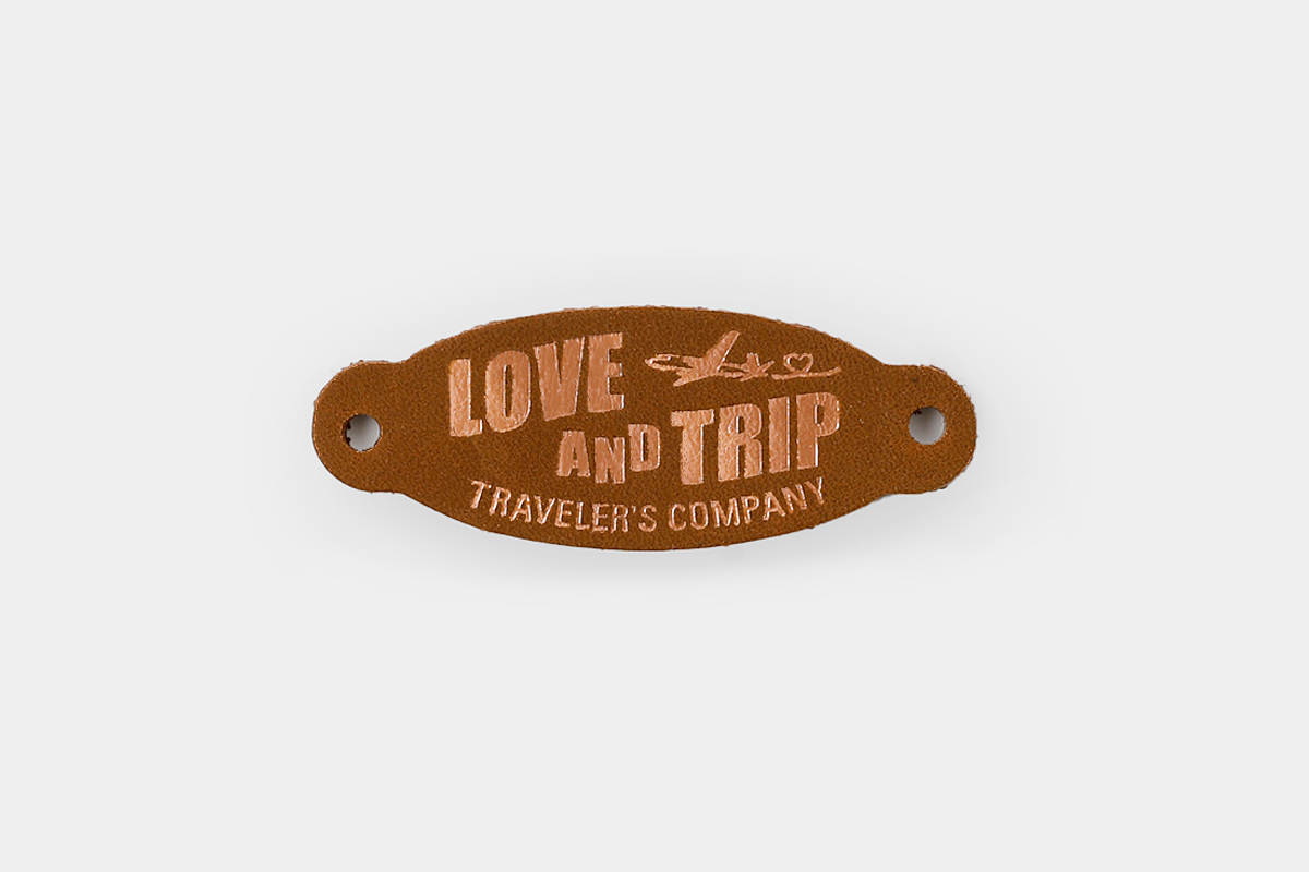 leather tag for TRAVELER'S notebook foil-stamped with "LOVE and TRIP".