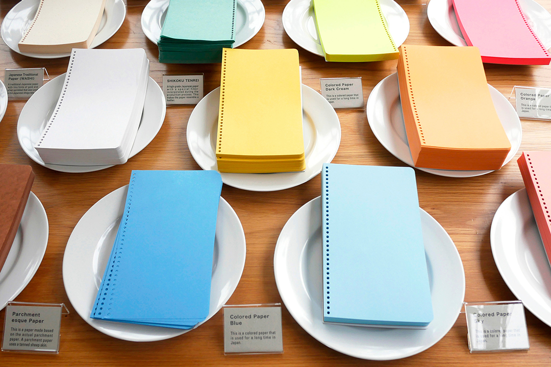 An array of paper types displayed on plates like a buffet.