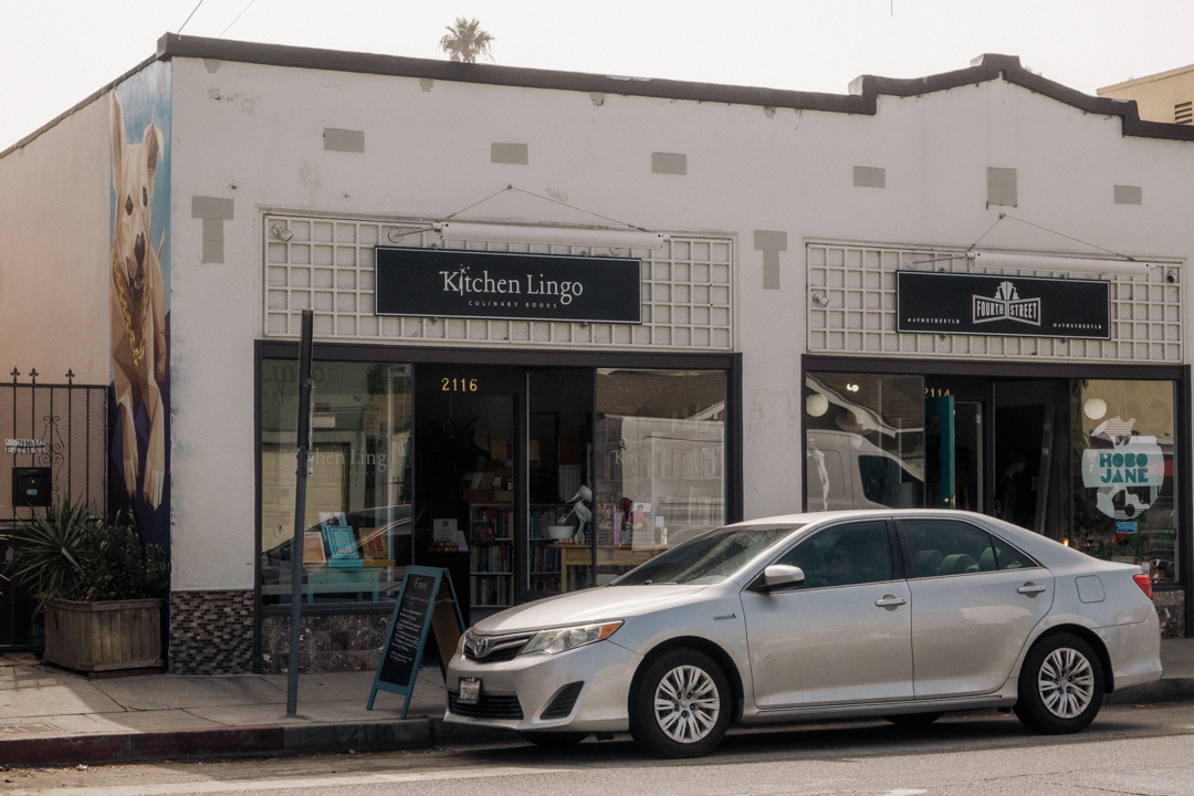 The storefront of Kitchen Lingo, a bookstore focusing on culinary genre.