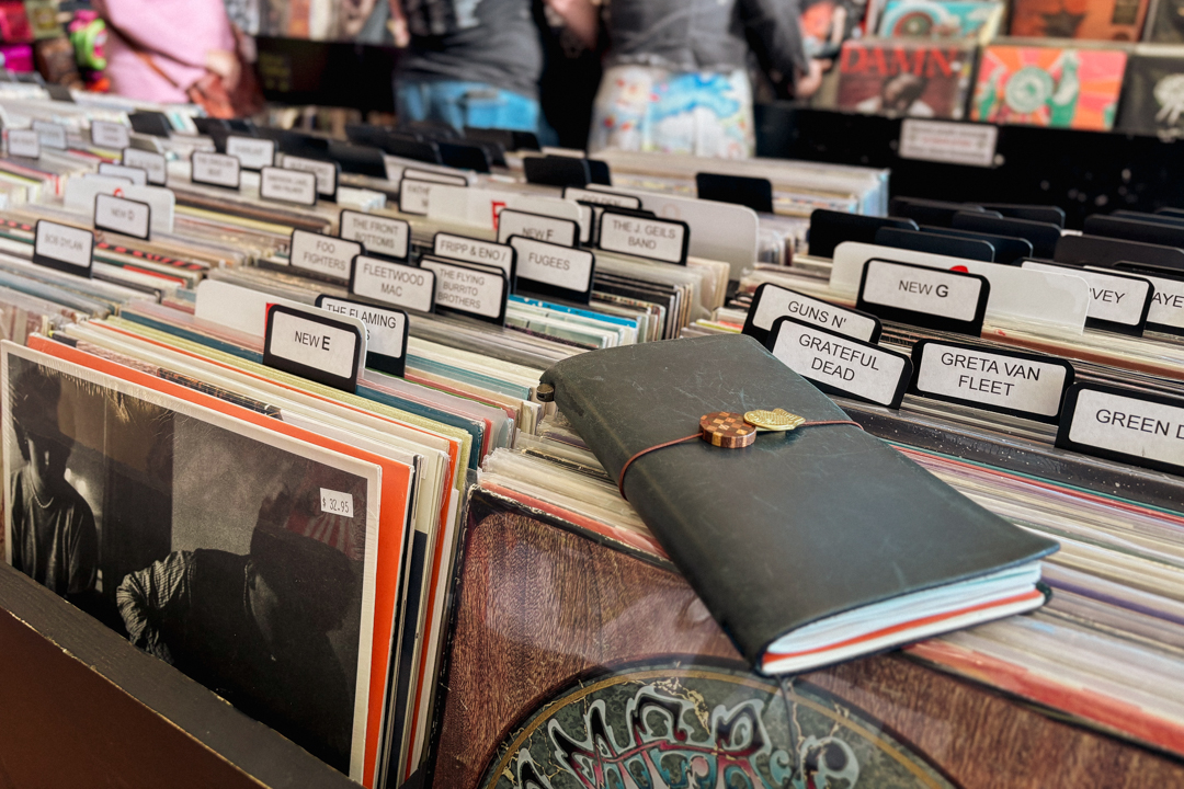 TRAVELER'S notebook sitting on boxes of old records.