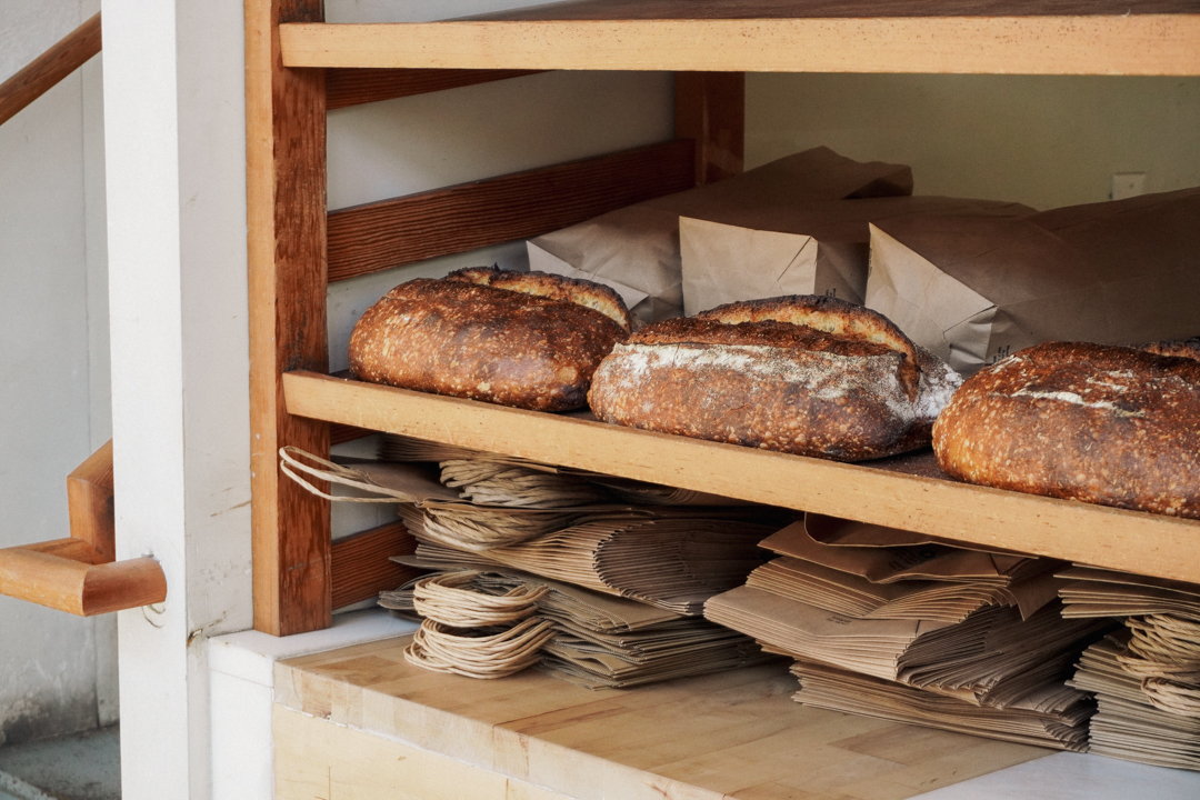 A shelf filled with Tartine Bakery's famous bread loafs. 