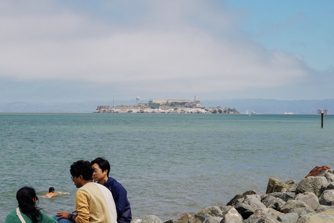 The view of Alcatraz Island in the distance from the beach.