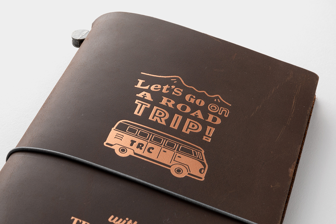 Close up of the copper foil design of the ROAD TRIP logo in copper foil.