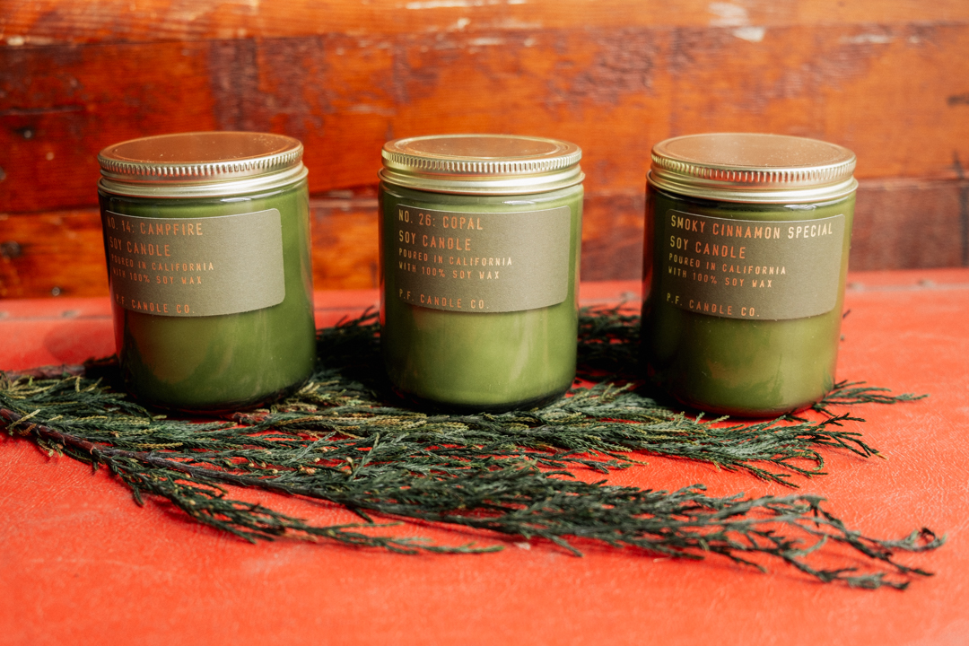 Three seasonal scents of P.F. Candles Co. - Campfire, Copal, and Smoky Cinnamon.