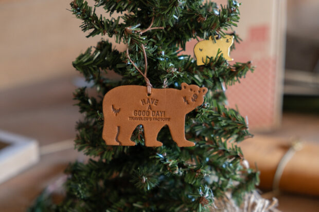 TF Holiday leather tag bear and brass charm little bear on a small christmas tree.