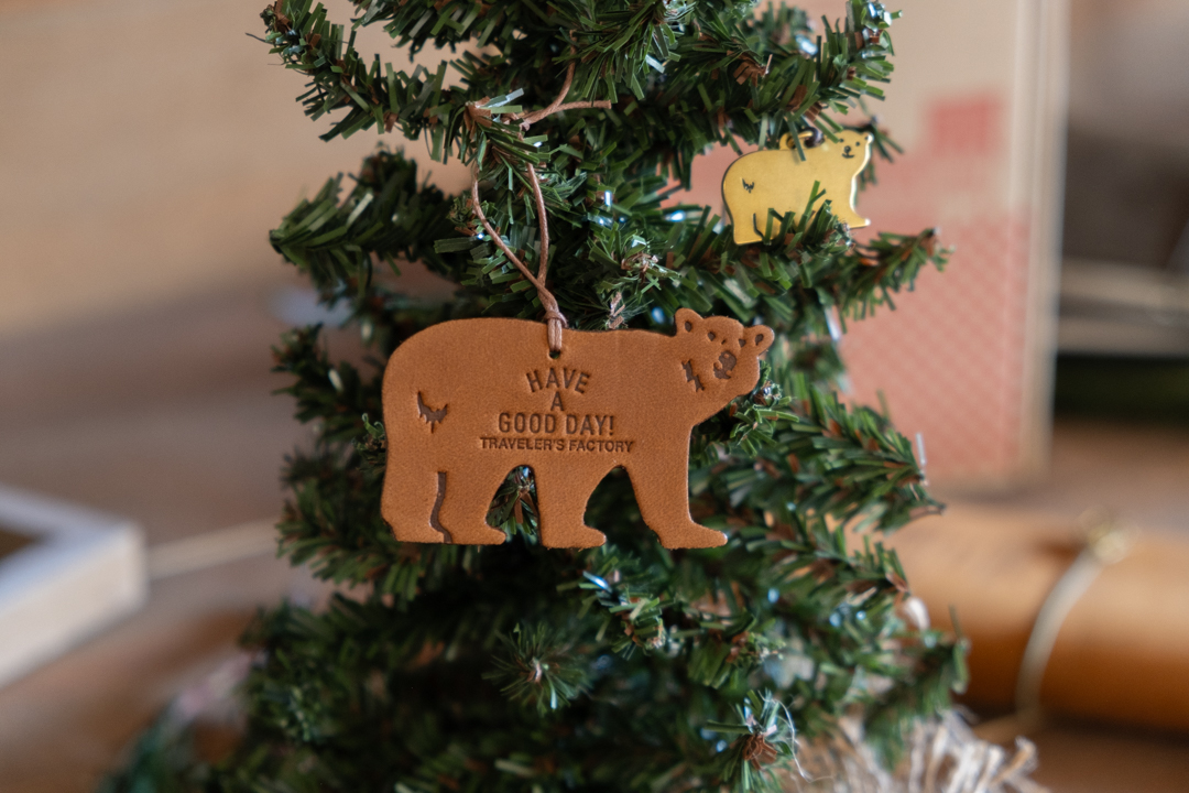 TF Holiday leather tag bear and brass charm little bear on a small christmas tree.