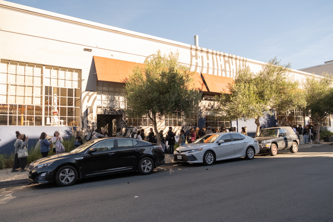 The line of people waiting outside of Heath News Stand to shop at the TRC Pop-Up.