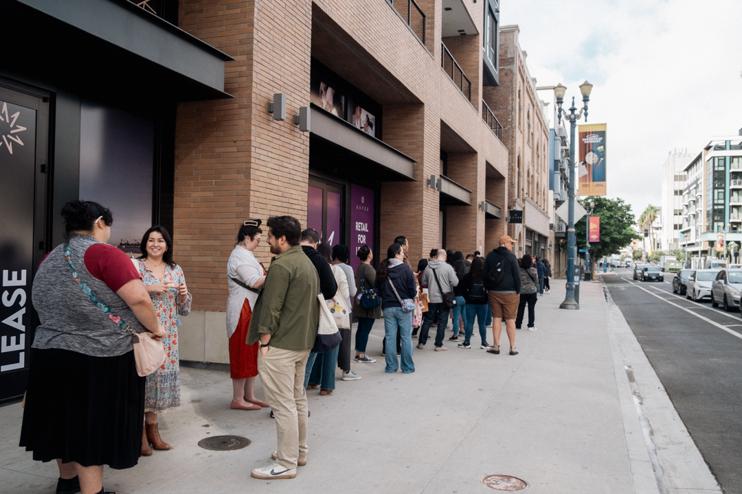 People in line outside of a building.