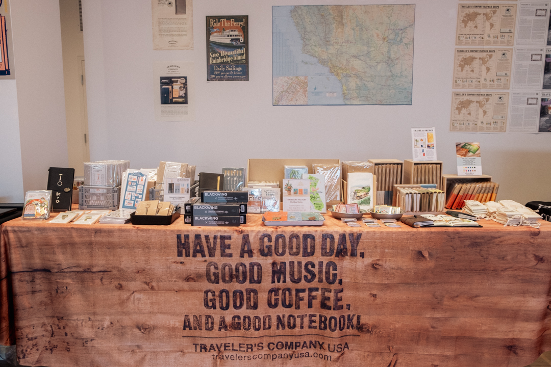 TRC USA table with TRAVELER'S notebooks and other TRAVELER'S COMPANY products.