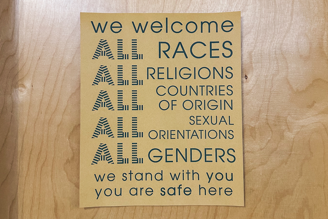 Poster saying we welcome all patrons, regardless of race, religion, gender, sexuality.