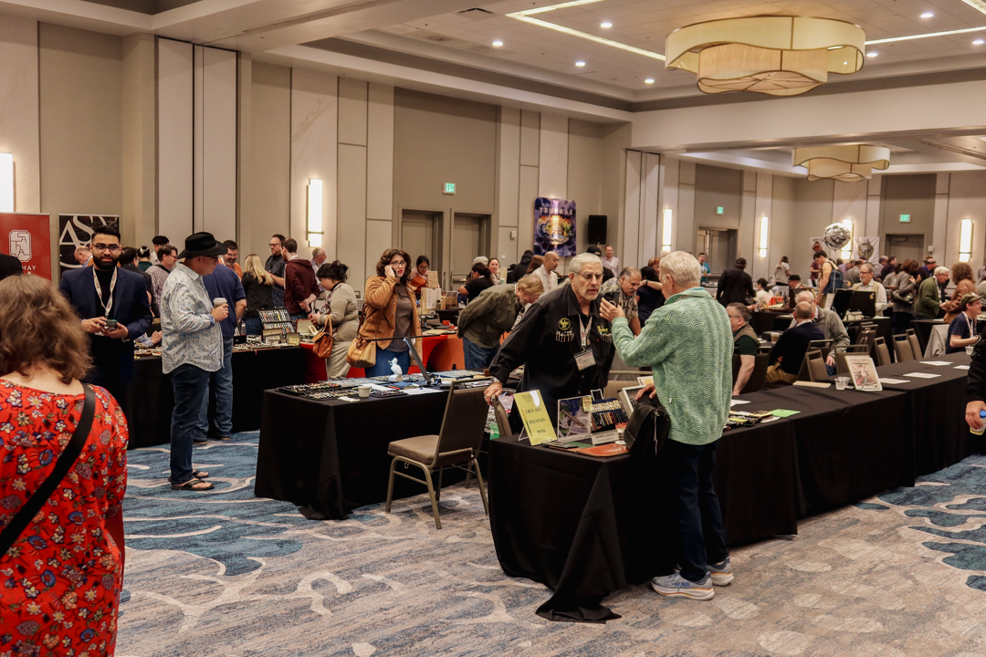 The crowds of California Pen Show attendees shopping at different booths and brands.