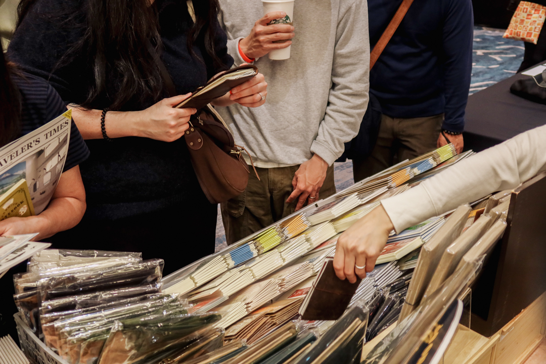 TRAVELER'S notebook fans shopping at the TRC USA table at the California Pen Show.