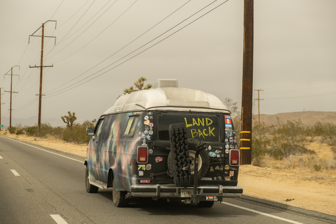 VW Bus driving down a highway.