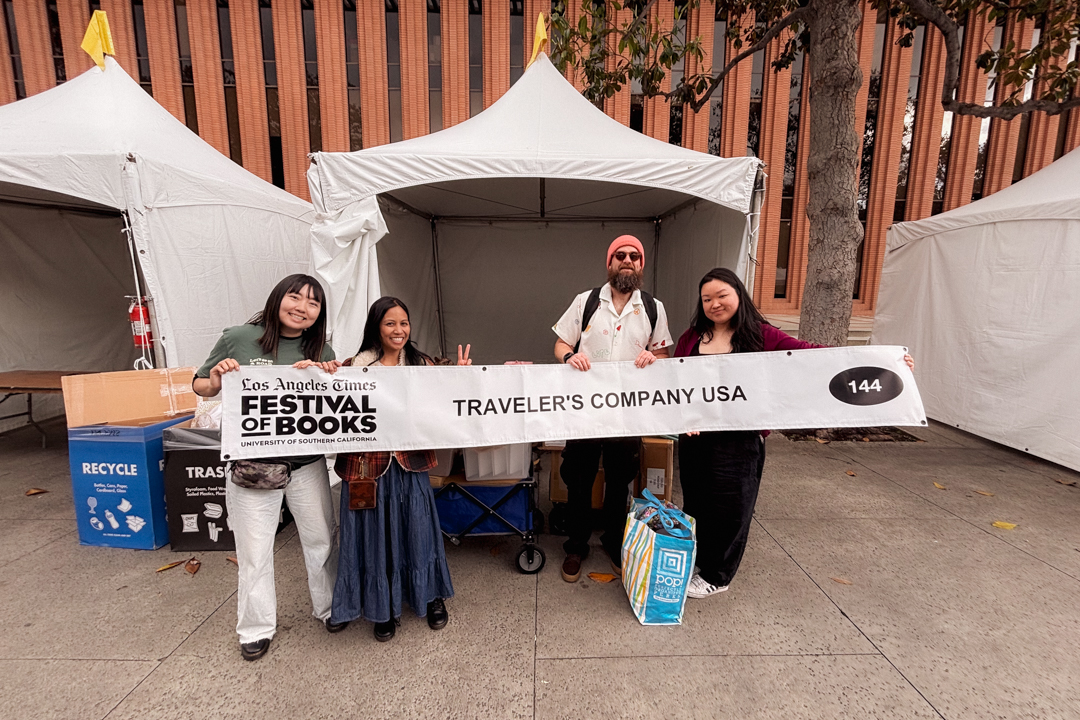 The TRC USA staff holding supplies and setting up for the booth.