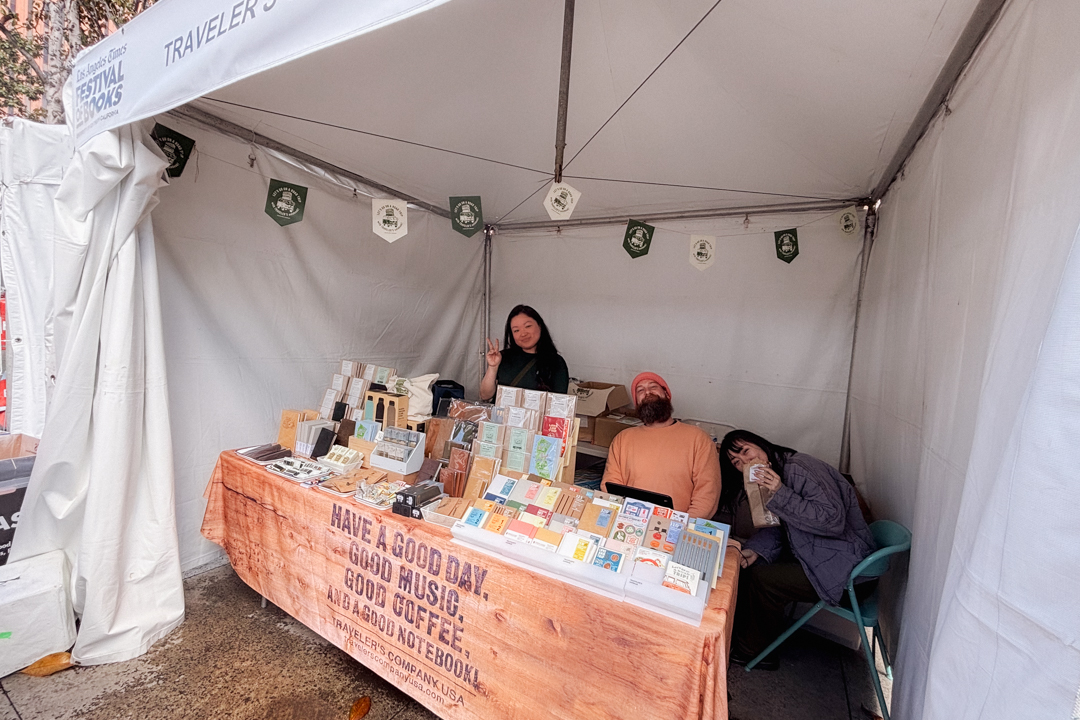 TRC USA staff posing at the TRC USA booth at the L.A. Times Festival of Books.