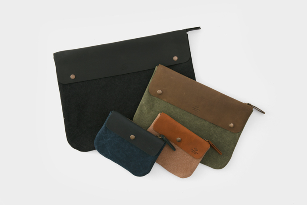 The TRAVELER'S FACTORY Canvas pouches in three size (S, M, L) in four color: black, olive, beige, and navy.
