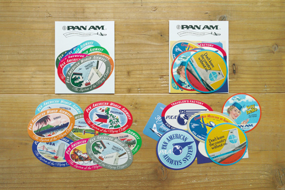TRAVELER'S FACTORY Pan Am sticker sets on a wooden table.