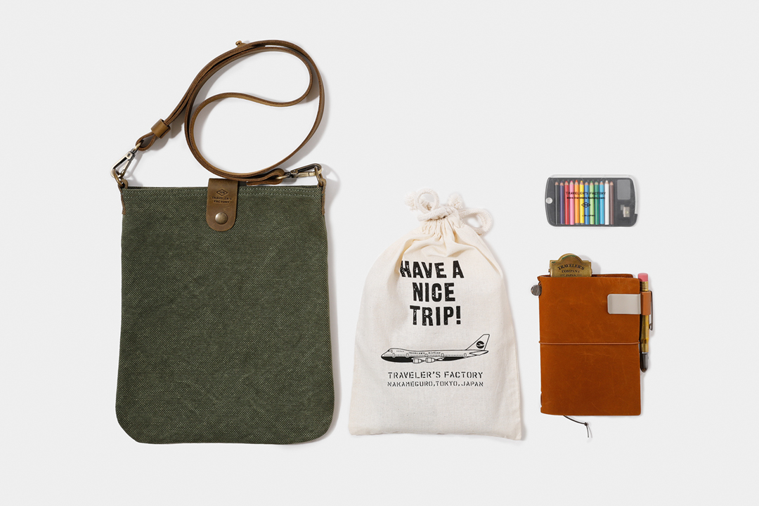 TRAVELER'S FACTORY Canvas Shoulder Bag beside contents that can fit inside it.