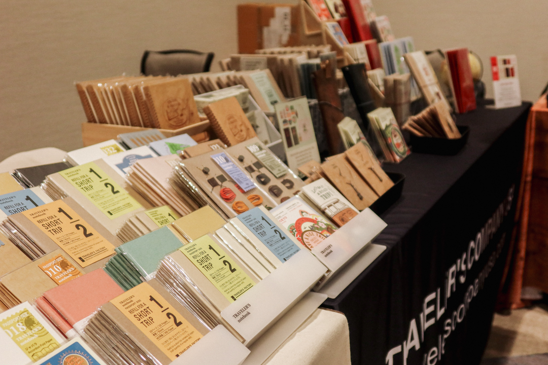 TRAVELER'S notebook inserts on a acrylic display at the TRC USA table at Little Craft Fest.