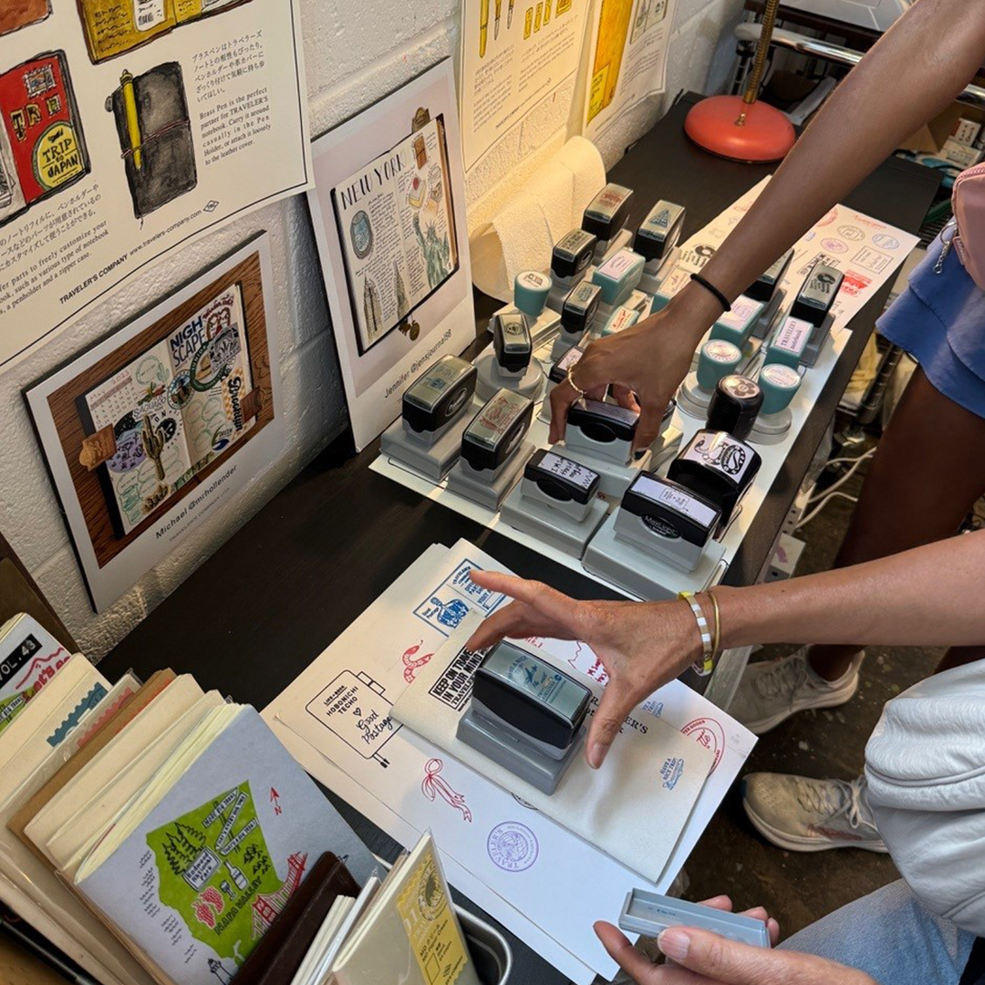 Customers enjoying the stamp caravan inside Good Postage.