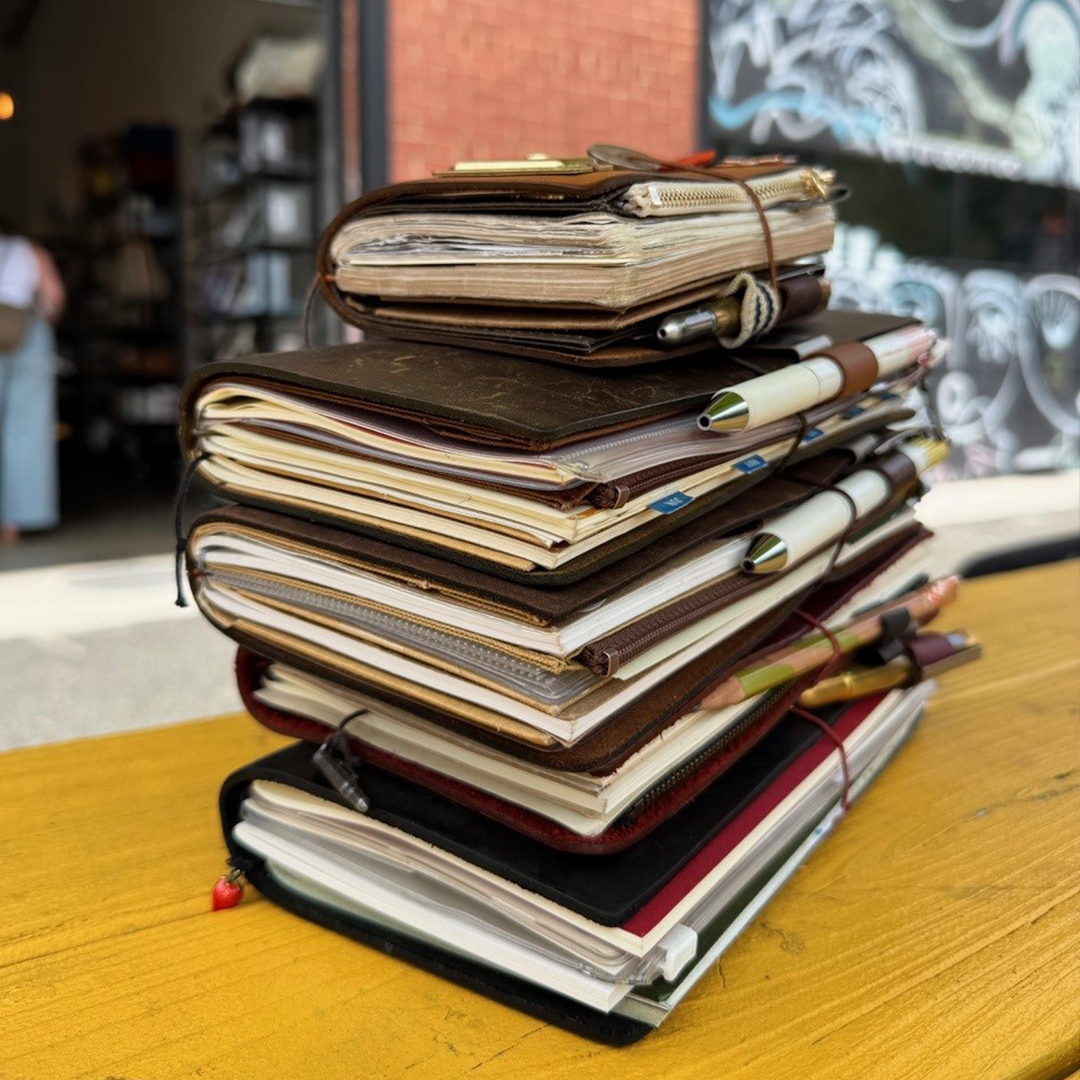 A stack of TRAVELER'S notebooks.