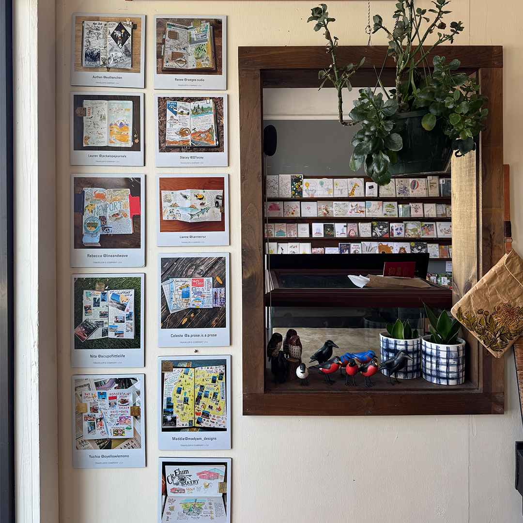 The wall of The Paper Mouse is decorated with winning entries from the Road Trip Submissions Contest.