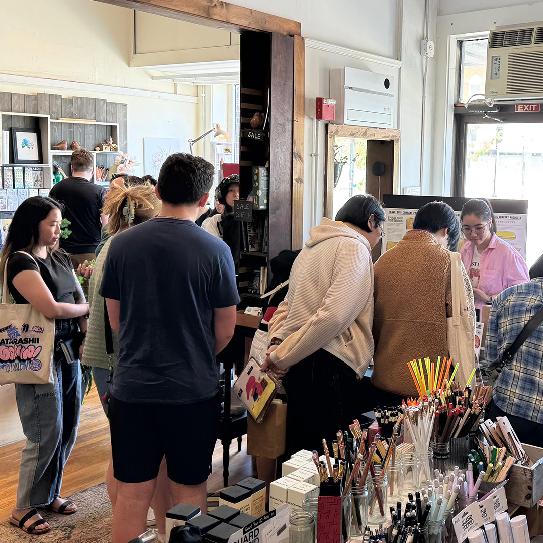 Fans gathered around the Stamp Caravan table at The Paper Mouse.