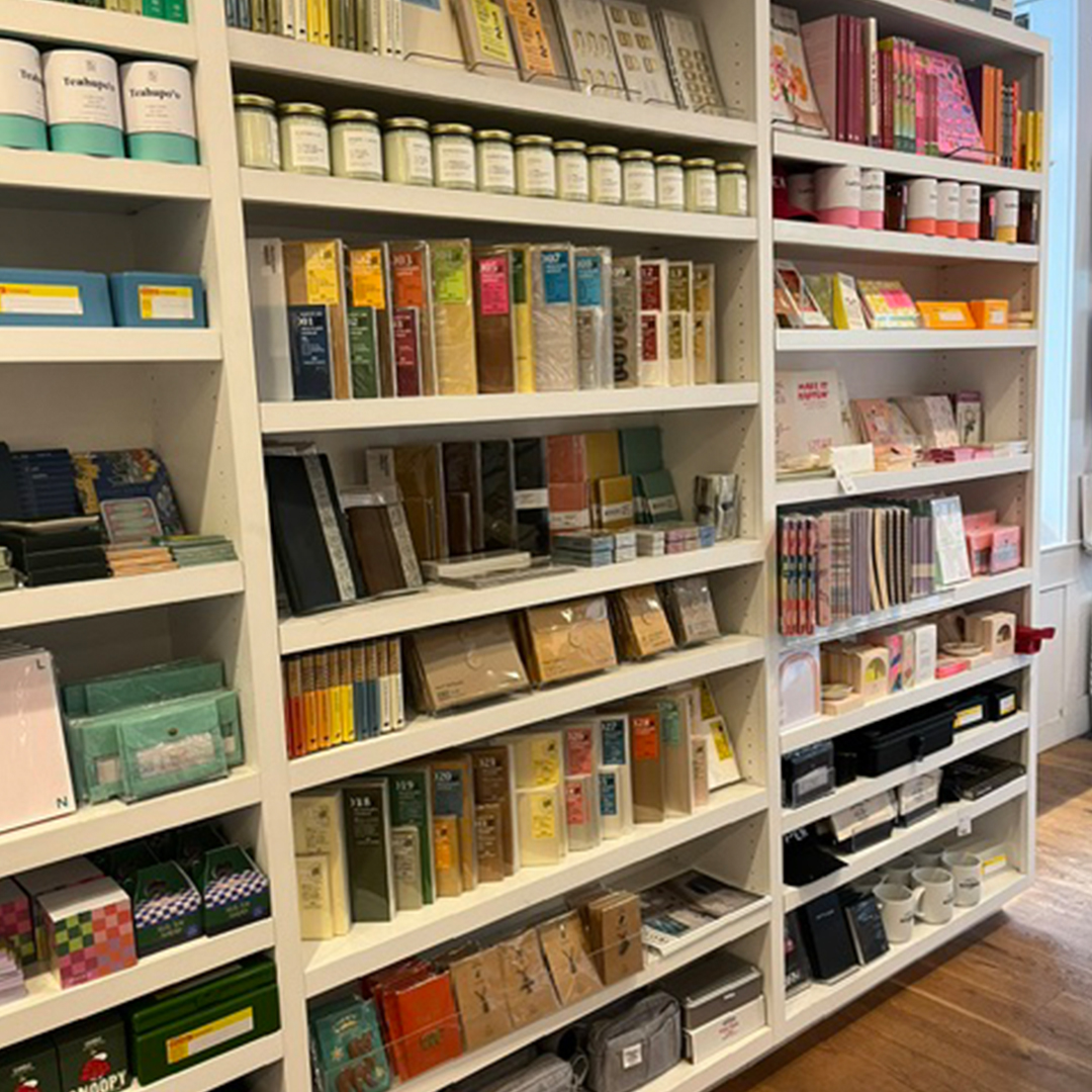 A wall of TRAVELER'S COMPANY items inside Penny Post.