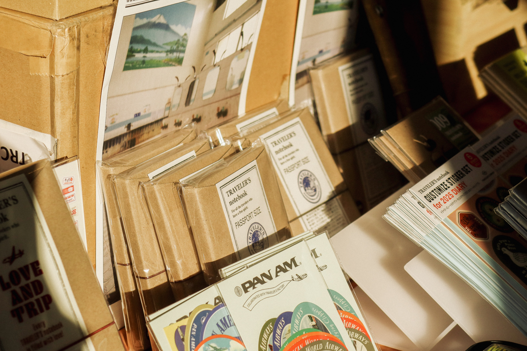 TRAVELER'S COMPANY items, masking tapes, and sticker sets on the TRC USA table at the SF Pen Show.