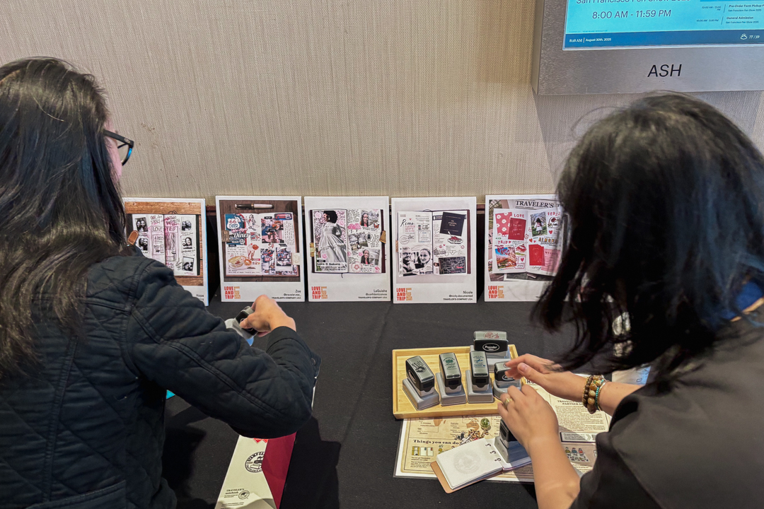 People using the TRC Stamp Caravan stamps at the TRC USA table at the SF Pen Show.