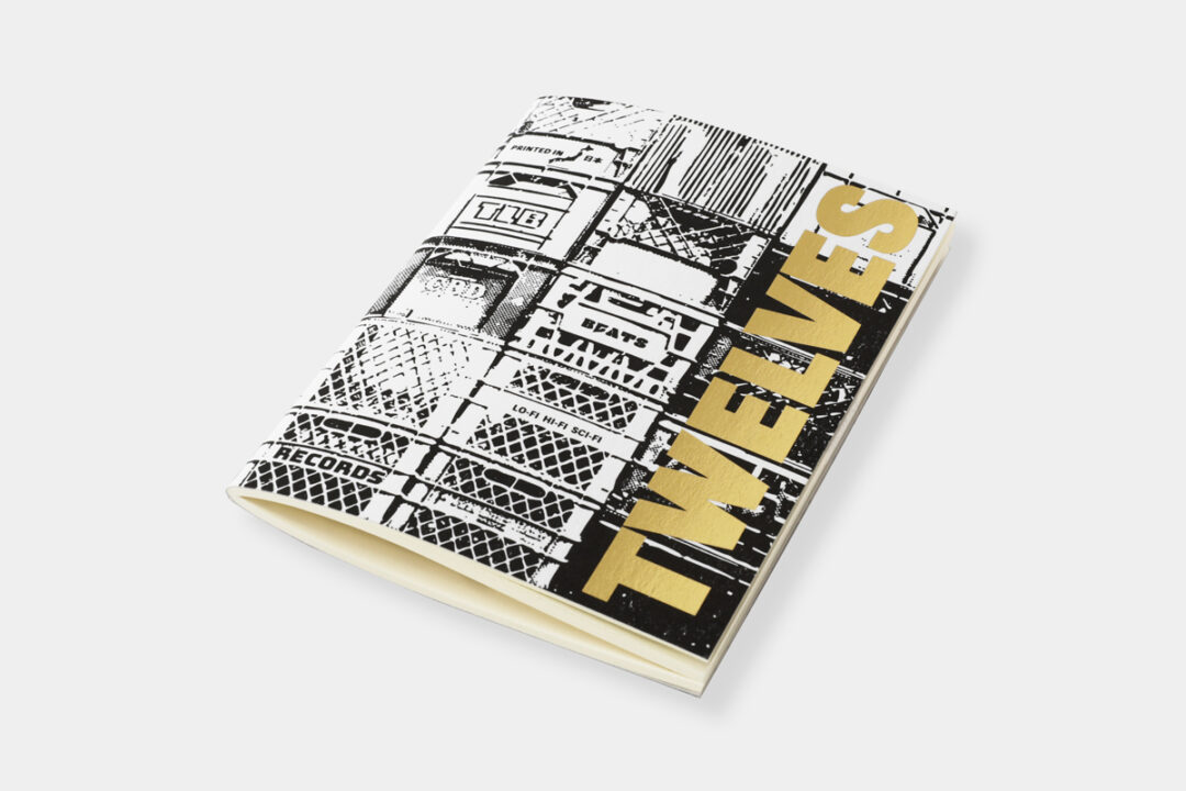 The gold foil embossing of TRAVELER’S notebook refill TWELVES RECORD Crate (Passport Size).