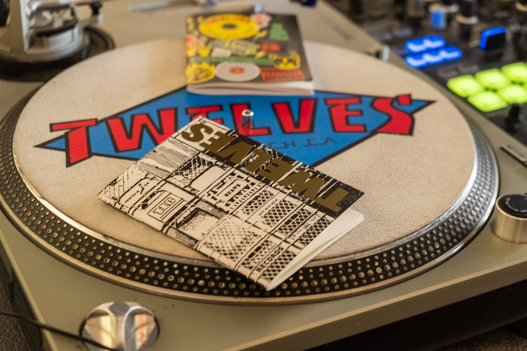 TRAVELER'S notebook refill TWELVES RECORD (Passport Size) on a 12" record player.
