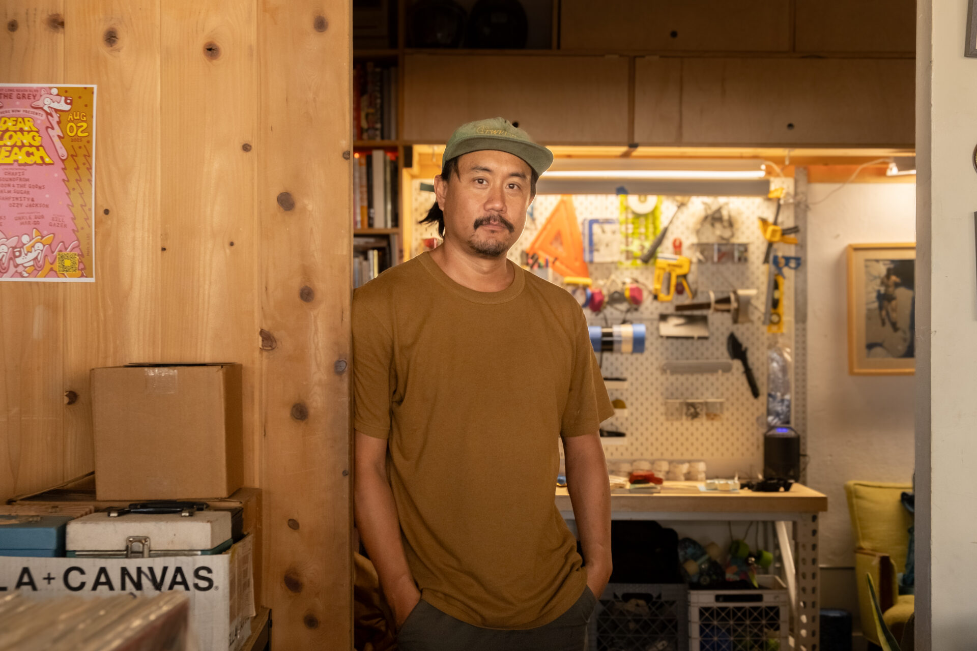 Tony Bach is the creative artist behind TWELVES RECORD, standing in his attached studio.
