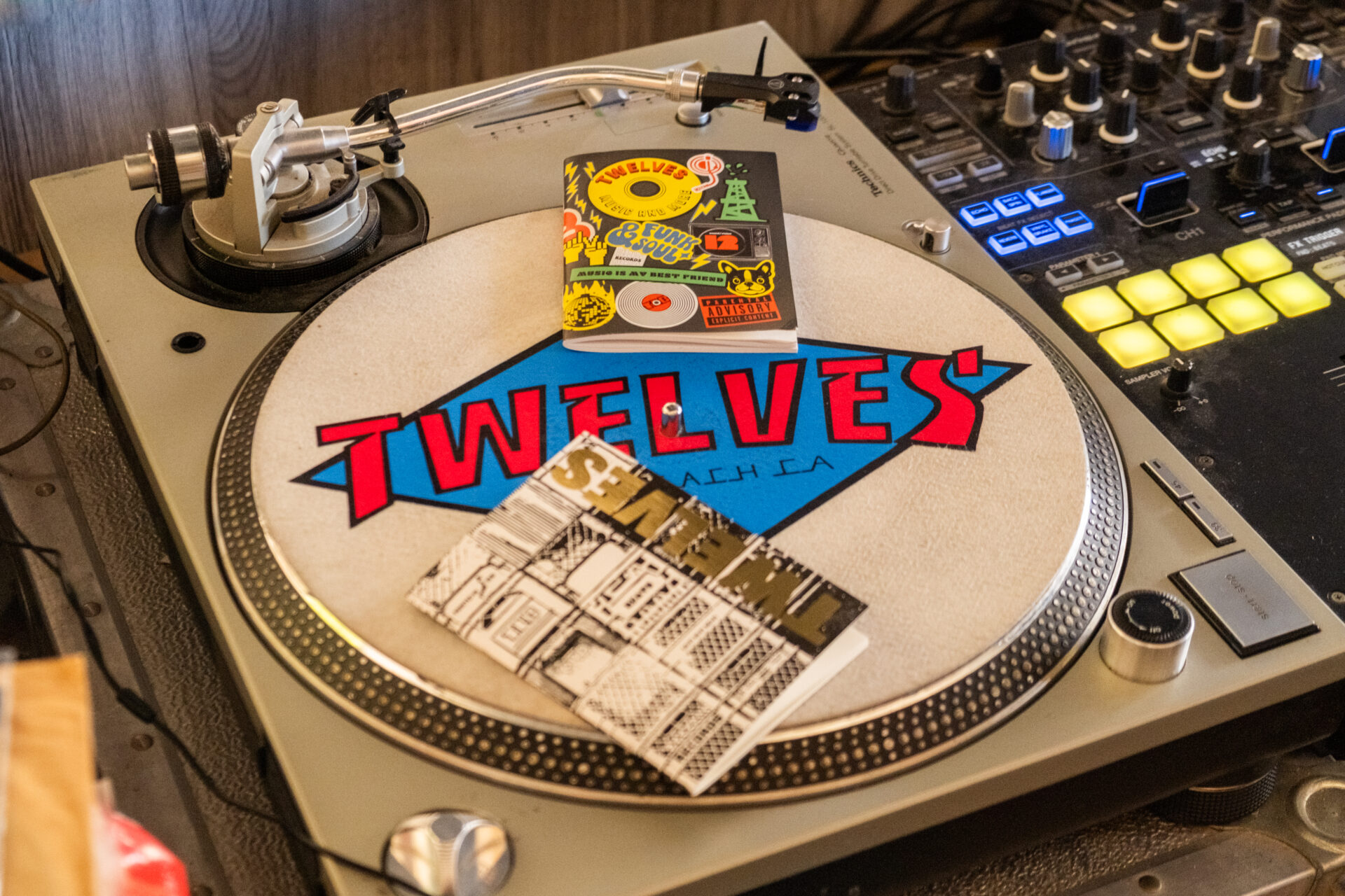 TRAVELER'S notebook refill TWELVES RECORD (Passport Size) on a 12" record player.
