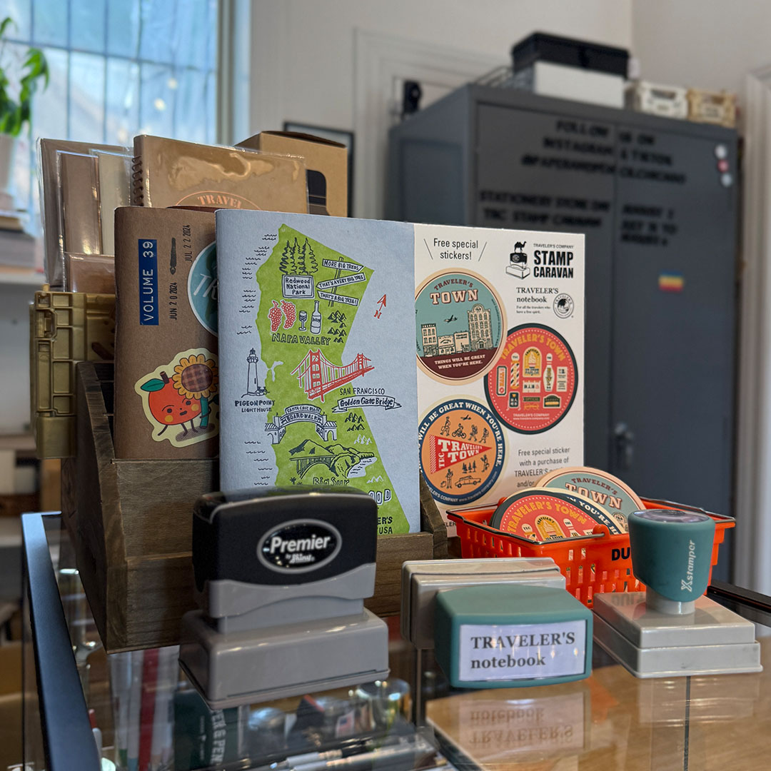 A display of TRAVELER'S notebook refill samples inside the Paper and Pencil store.