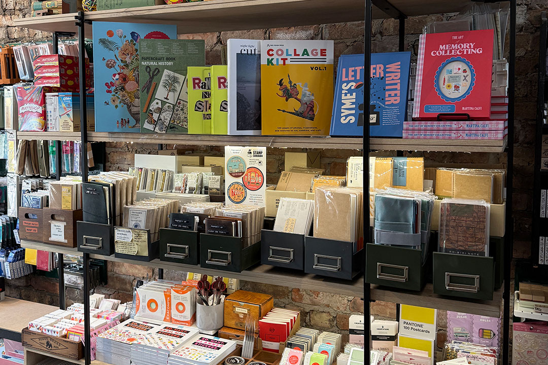 The TRAVELER'S COMPANY display inside the Paper and Pencil store.