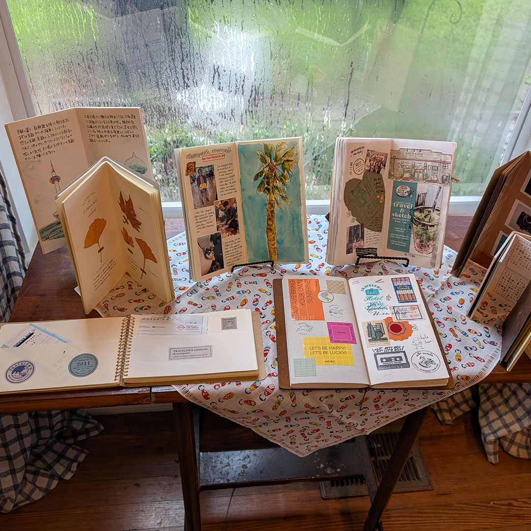 A display of TRAVELER'S notebook refills by the window.