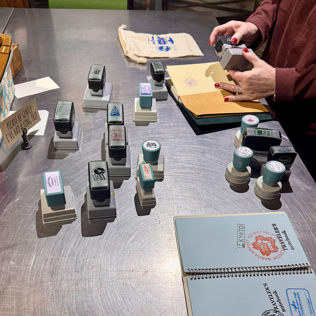 A fan collecting stamps in her TRAVELER'S notebook refill.