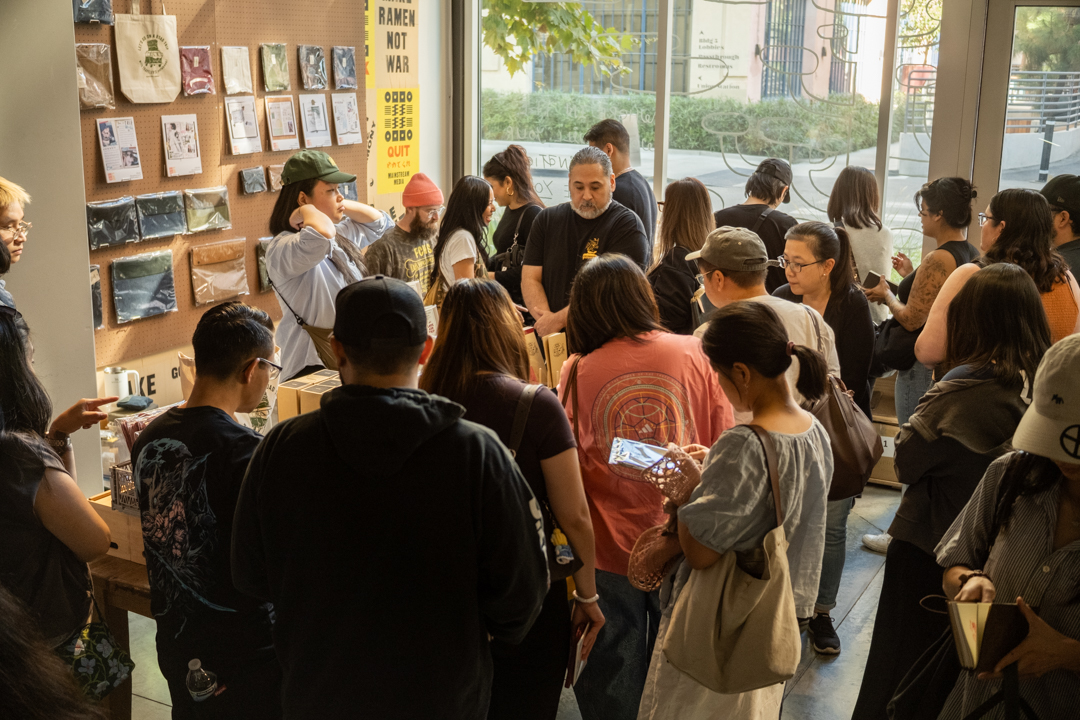 Another angle of the bustling event showing the warm, engaged atmosphere as shoppers discovered new products.