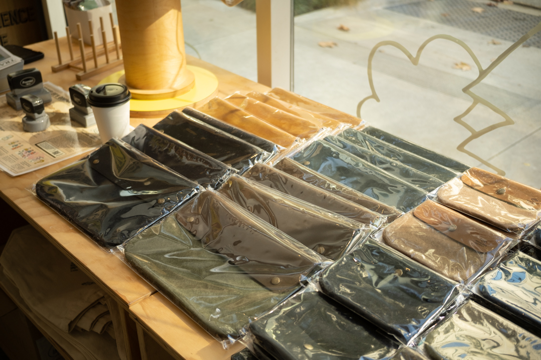 TRAVELER'S leather notebook covers in various colors arranged on display, showcasing the range of textures and finishes available.