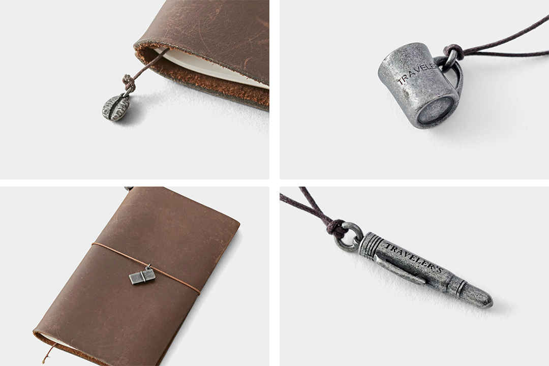TRAVELER'S FACTORY original tin charms in the shape of a coffee bean, a mug, a TRAVELER'S notebook, and a pen.
