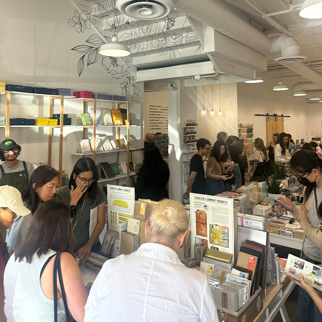 Fans and customers fill the store during the Stamp Caravan event.