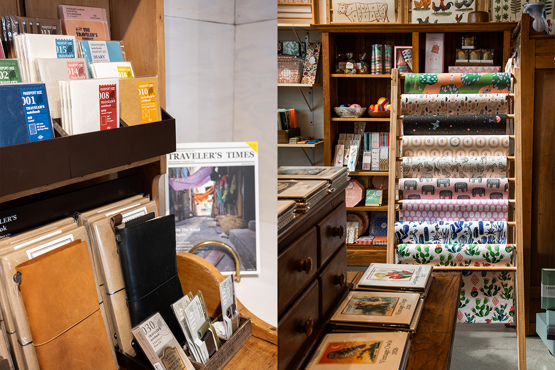 The interior of Paper and Grace stationery shop is filled with TRAVELER'S COMPANY items, such as TRAVELER'S notebooks, refills, and other paper goods and stationery, which are displayed on beautiful vintage wooden decor and dried flowers.